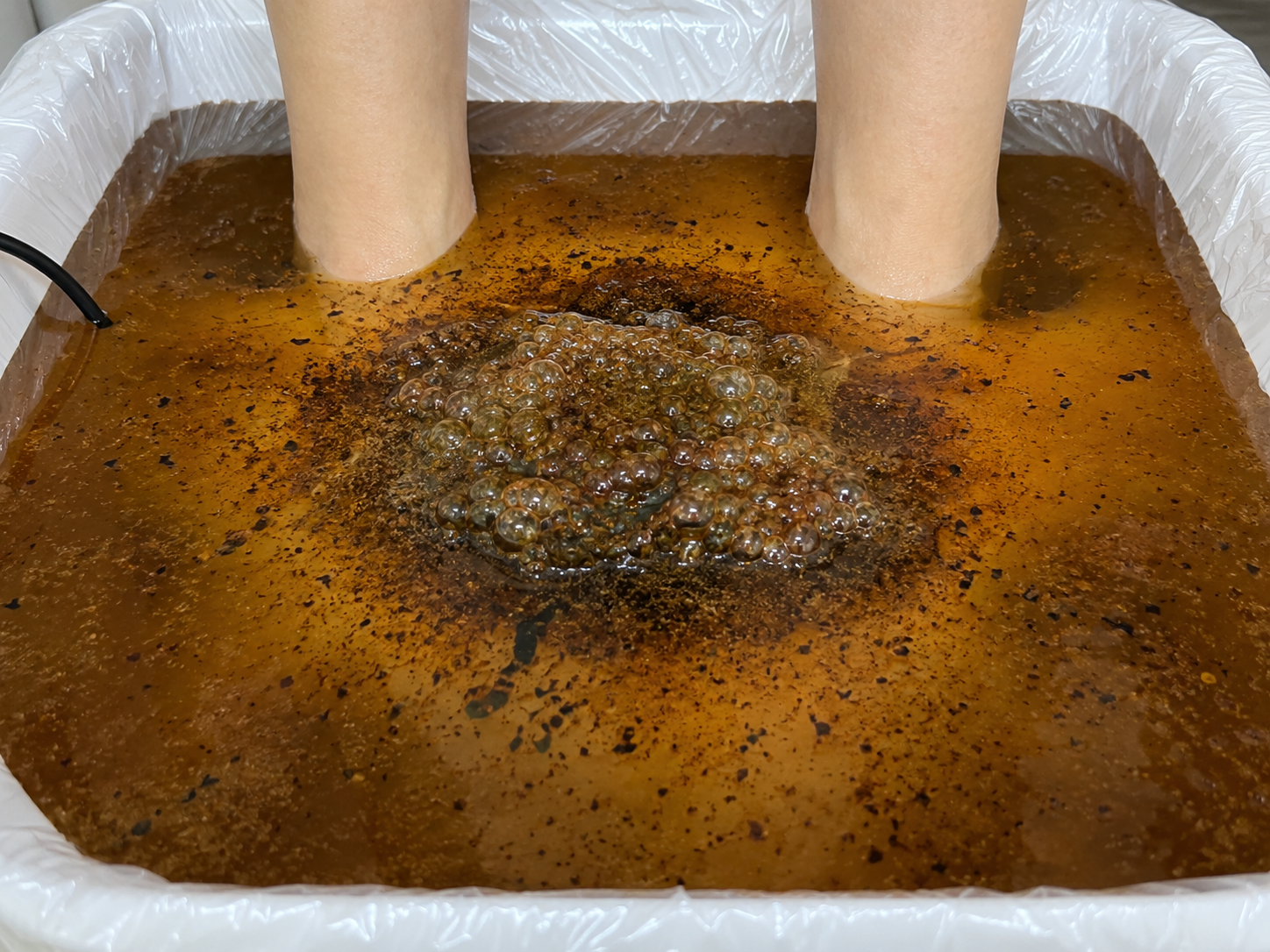 Foot bath with darker water